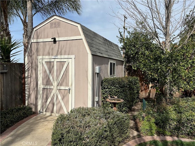 view of shed with fence