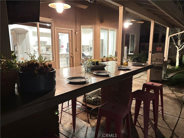 dining space with a ceiling fan