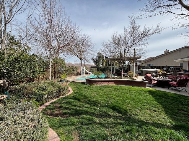 view of yard featuring a patio and a fenced in pool