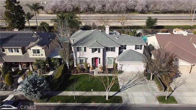 birds eye view of property with a residential view