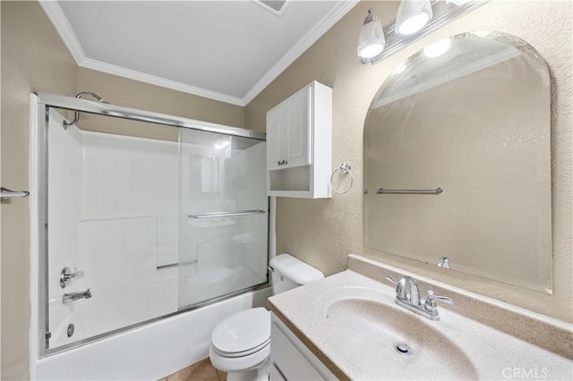 full bathroom featuring crown molding, vanity, shower / bath combination with glass door, and toilet