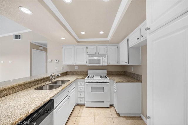 kitchen with sink, white appliances, crown molding, a tray ceiling, and white cabinets