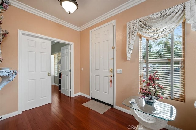 foyer entrance featuring dark hardwood / wood-style flooring and crown molding