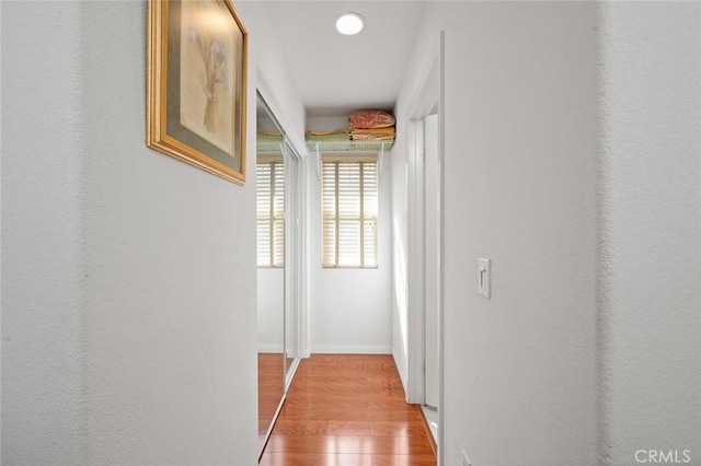 hall with light wood-type flooring