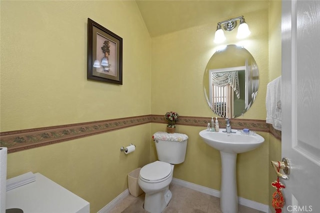 bathroom with tile patterned floors, toilet, and sink