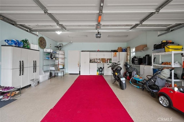 garage featuring a garage door opener