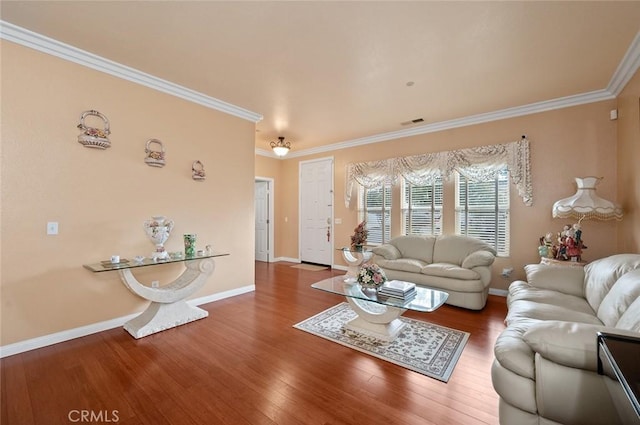 living room with hardwood / wood-style flooring and crown molding