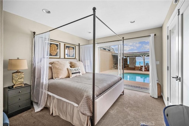 carpeted bedroom featuring access to exterior