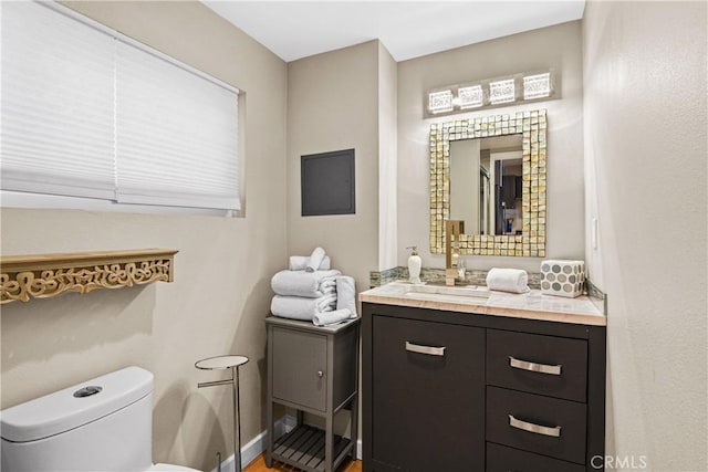 bathroom featuring vanity and toilet