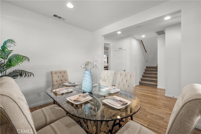 dining area featuring light wood-type flooring