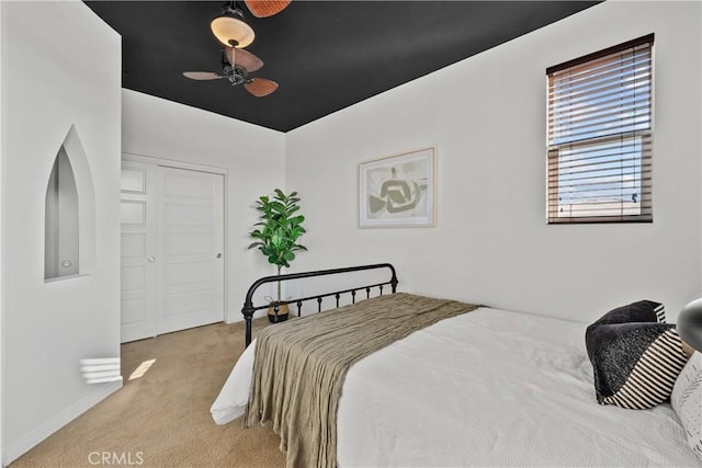 carpeted bedroom featuring a closet