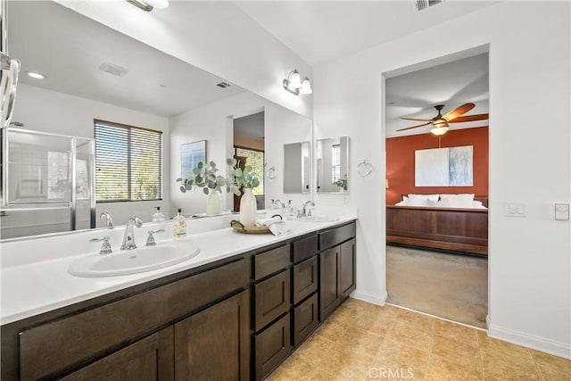 bathroom featuring vanity, ceiling fan, and a shower with shower door