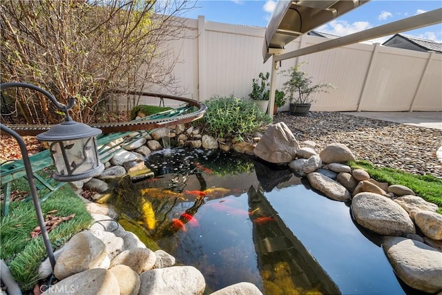 view of yard with a small pond