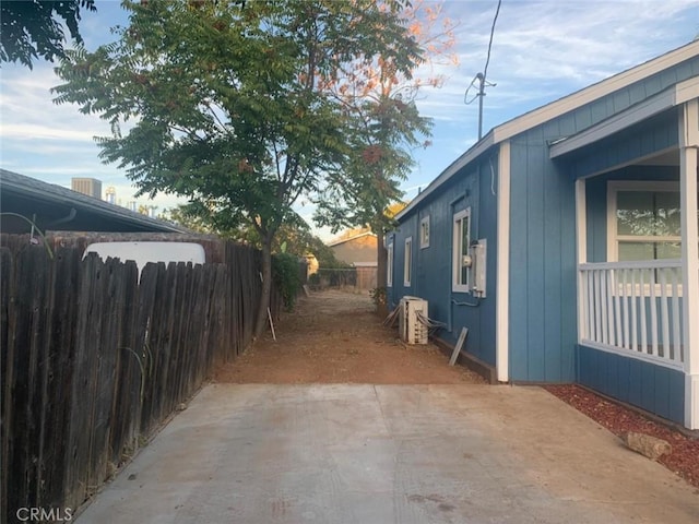 view of property exterior featuring ac unit and a patio