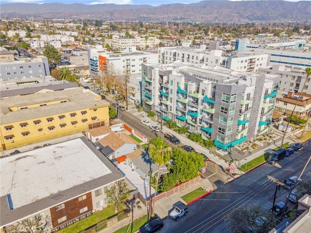 birds eye view of property featuring a mountain view