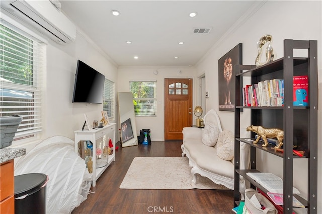 interior space with dark wood-type flooring, ornamental molding, and a wall mounted air conditioner