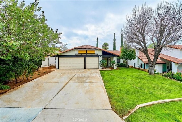 view of front of home featuring a garage and a front lawn