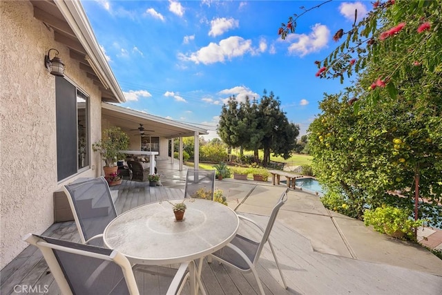 view of patio / terrace featuring an outdoor pool and outdoor dining space