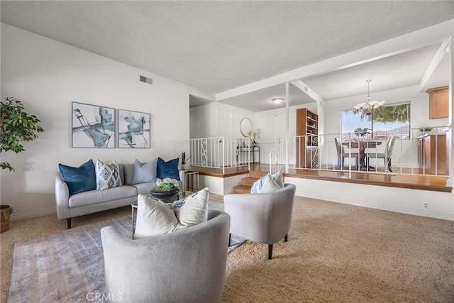 living room featuring carpet flooring, a chandelier, and a textured ceiling