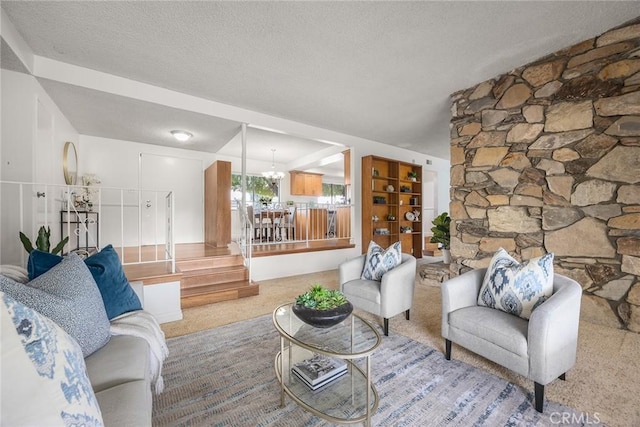 living room with light carpet, a textured ceiling, and a chandelier