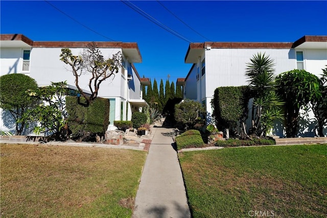 view of home's exterior with a lawn