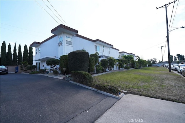 view of home's exterior featuring a yard