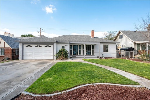 ranch-style house with a garage and a front lawn