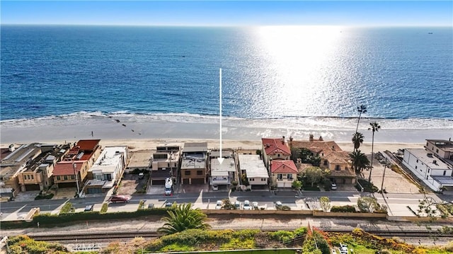 bird's eye view featuring a beach view and a water view