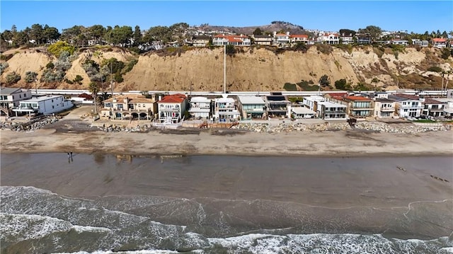 birds eye view of property with a water and mountain view