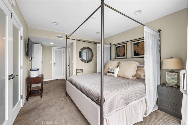 bedroom featuring light colored carpet