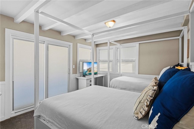 bedroom featuring beamed ceiling