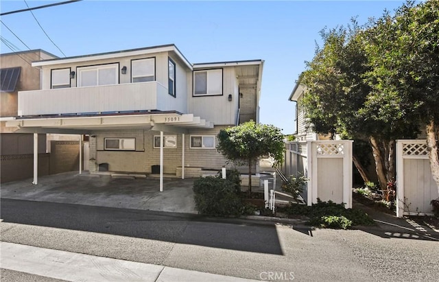 view of front of home with a carport