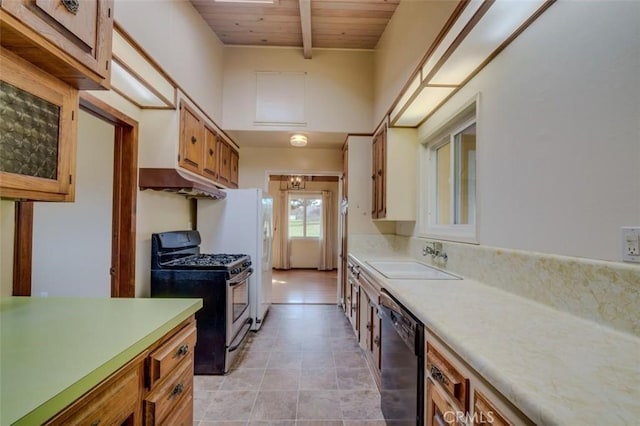 kitchen with sink, beam ceiling, black dishwasher, stainless steel range with gas cooktop, and wooden ceiling