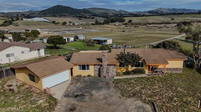 birds eye view of property with a mountain view