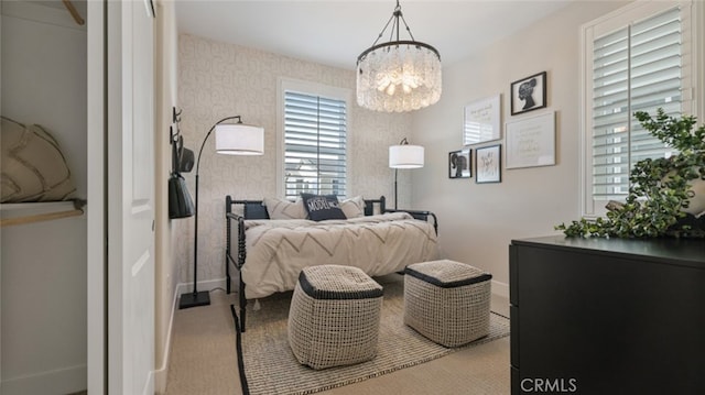 bedroom featuring a notable chandelier