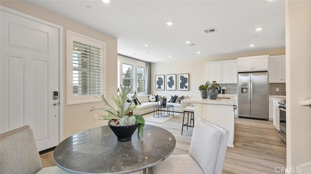 dining room featuring light wood-type flooring