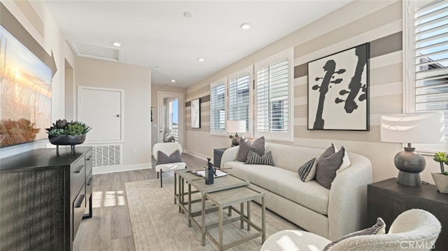 living room with light hardwood / wood-style floors