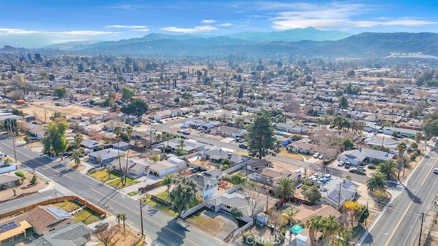 birds eye view of property with a mountain view