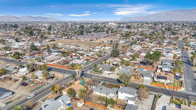 birds eye view of property featuring a mountain view