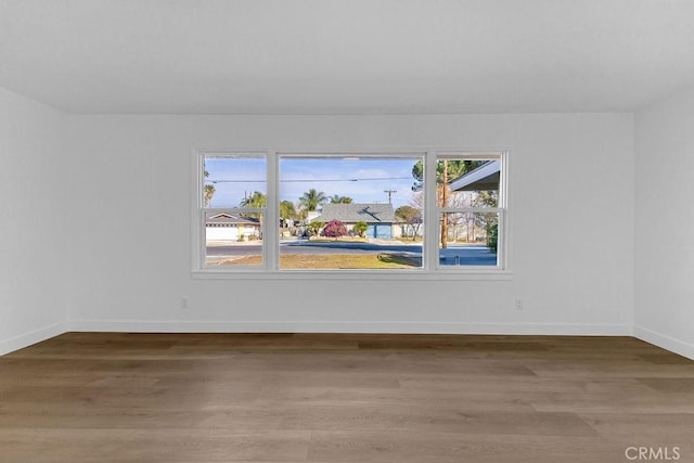 spare room with light hardwood / wood-style flooring