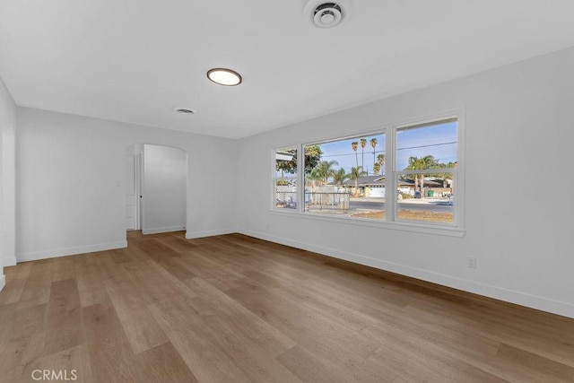 empty room with light hardwood / wood-style flooring