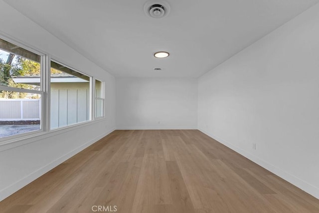 spare room with light hardwood / wood-style floors