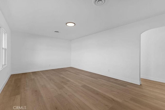 unfurnished room featuring light hardwood / wood-style floors