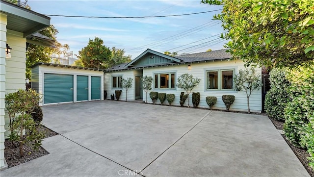 view of front of house with an outbuilding and a garage