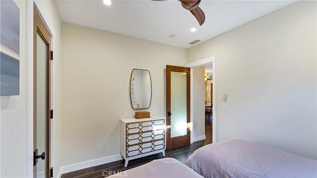 bedroom featuring ceiling fan and dark hardwood / wood-style floors