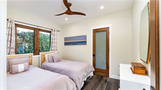 bedroom featuring ceiling fan and dark hardwood / wood-style flooring