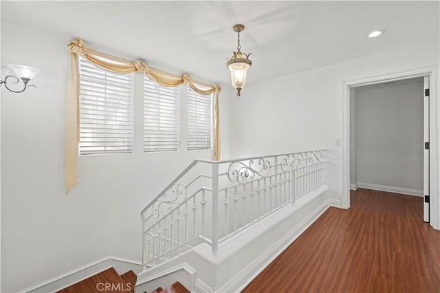 hallway featuring dark hardwood / wood-style flooring