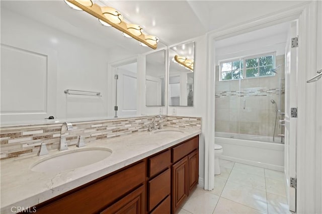 full bathroom with toilet, vanity, enclosed tub / shower combo, tile patterned flooring, and backsplash