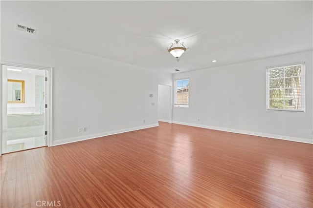 spare room featuring hardwood / wood-style floors