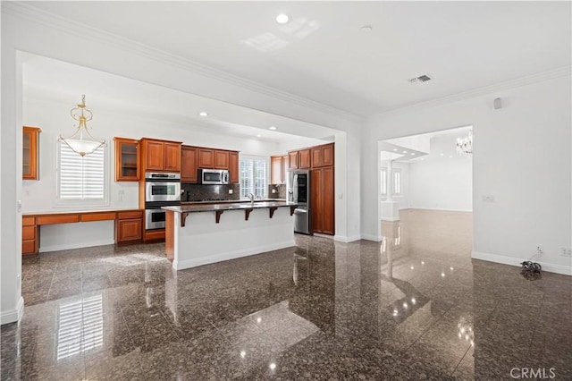 kitchen featuring sink, backsplash, a kitchen breakfast bar, ornamental molding, and stainless steel appliances